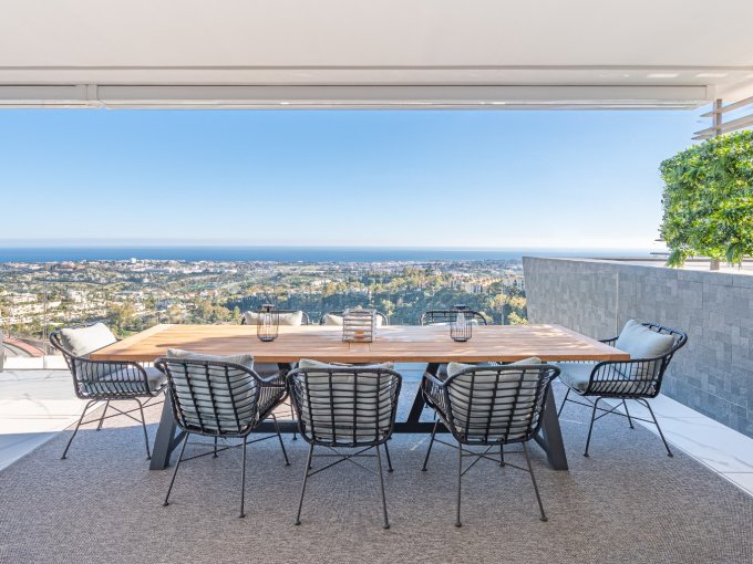 Outdoor table Middle Floor Apartment with Golf & Sea Views for sale