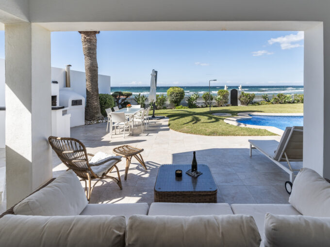 Covered terrace First Line Beach Villa in Vistamar Costabella for Sale. Property for sale in Marbella.