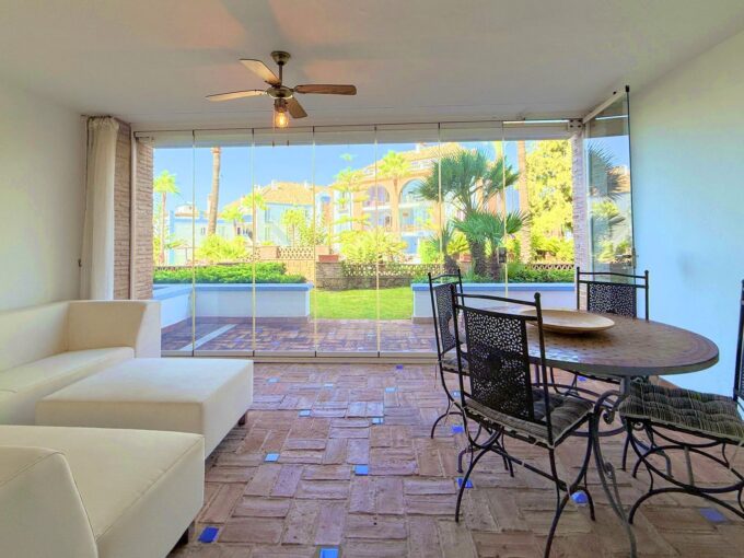 Outdoor table Beachfront Garden Apartment for Sale in Casares, Costa del Sol