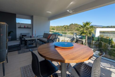 Outdoor table Apartment for Sale with Top Amenities in Selwo, Estepona, Marbella